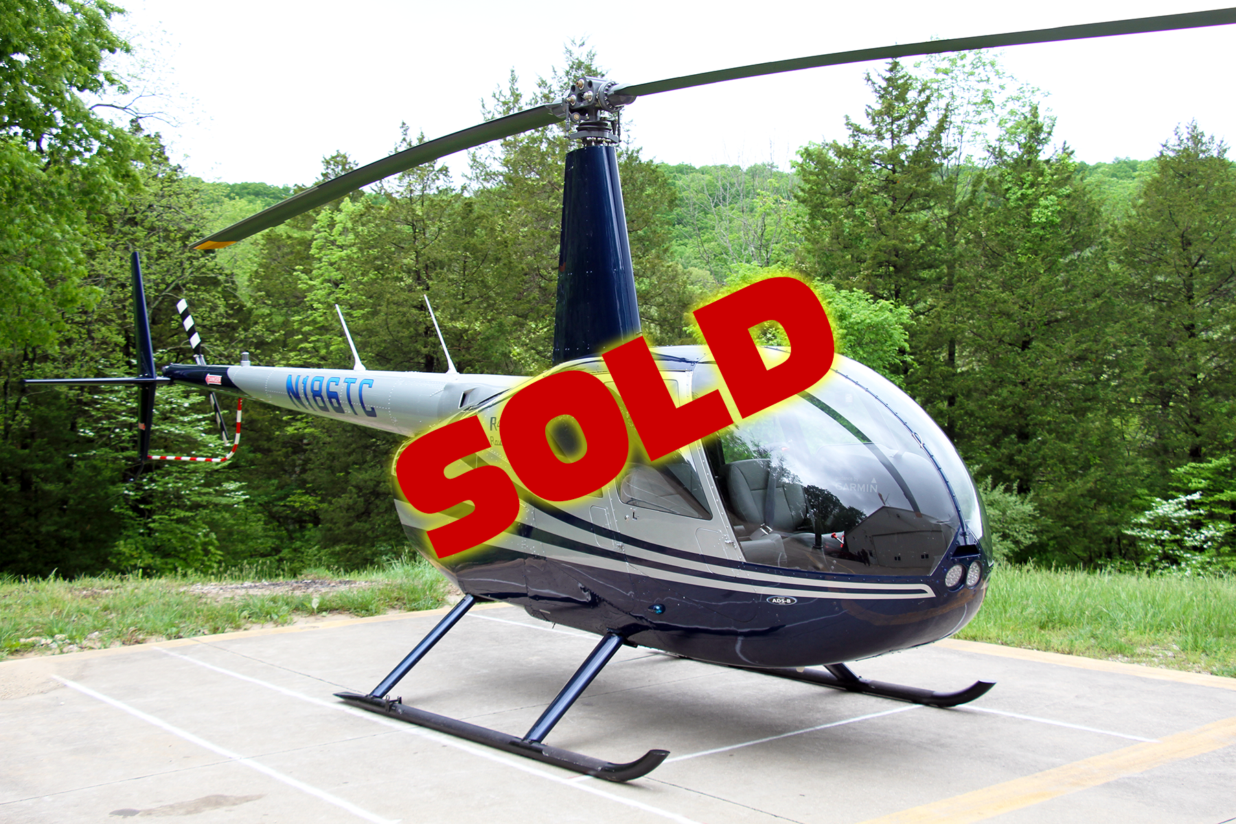 large photo of Robinson R44 Raven II N186TC fuel-injected helicopter for sale